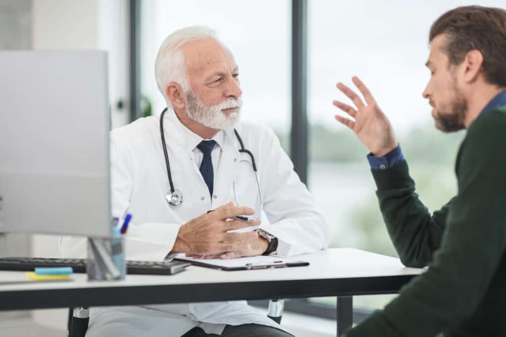 man talking to doctor