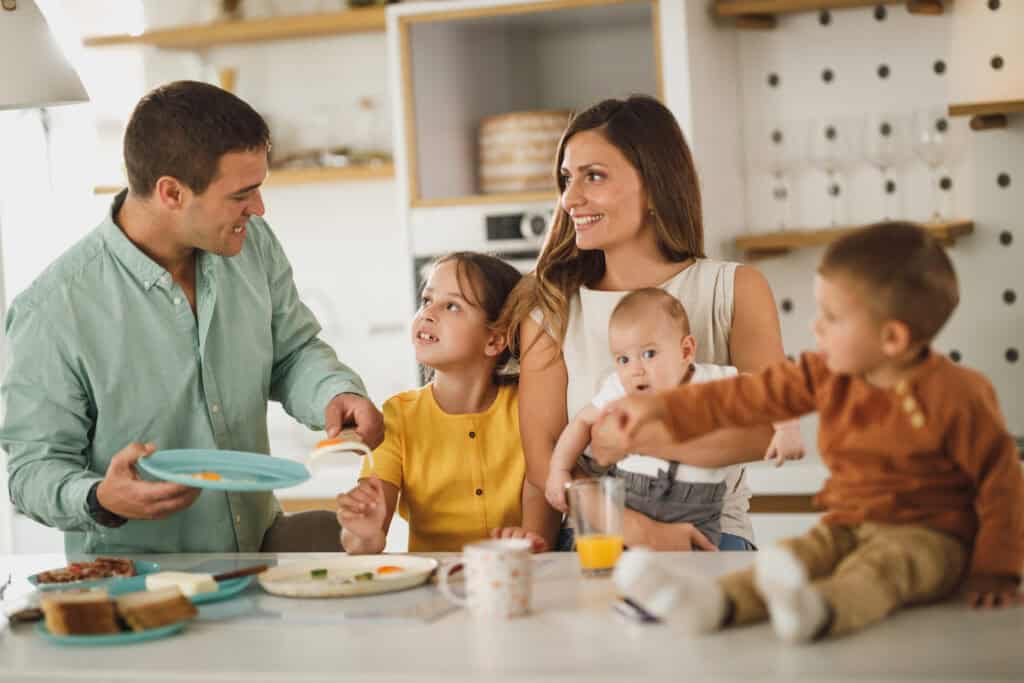 family together in kitchen