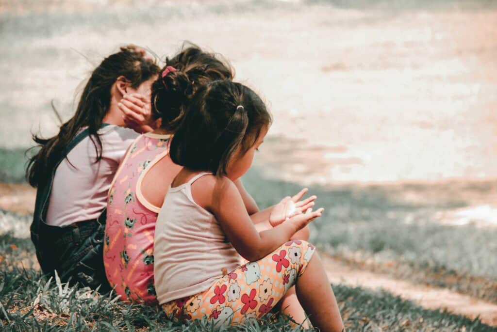 three little girls sitting