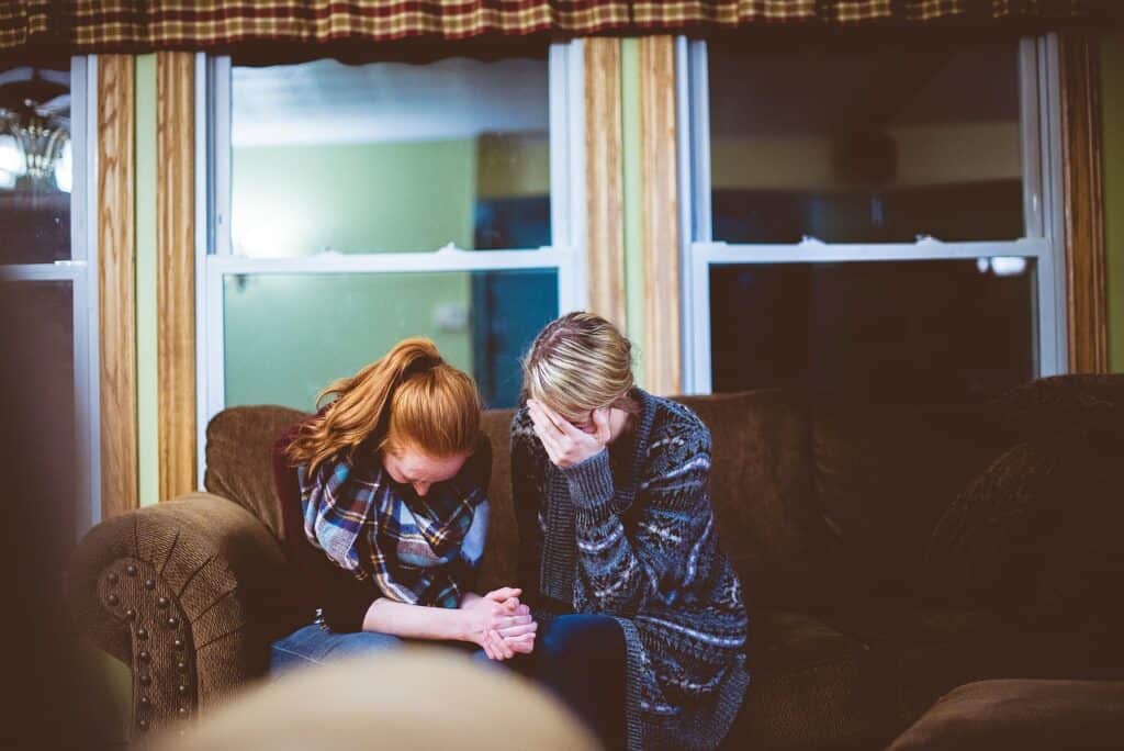 Lady and teen crying