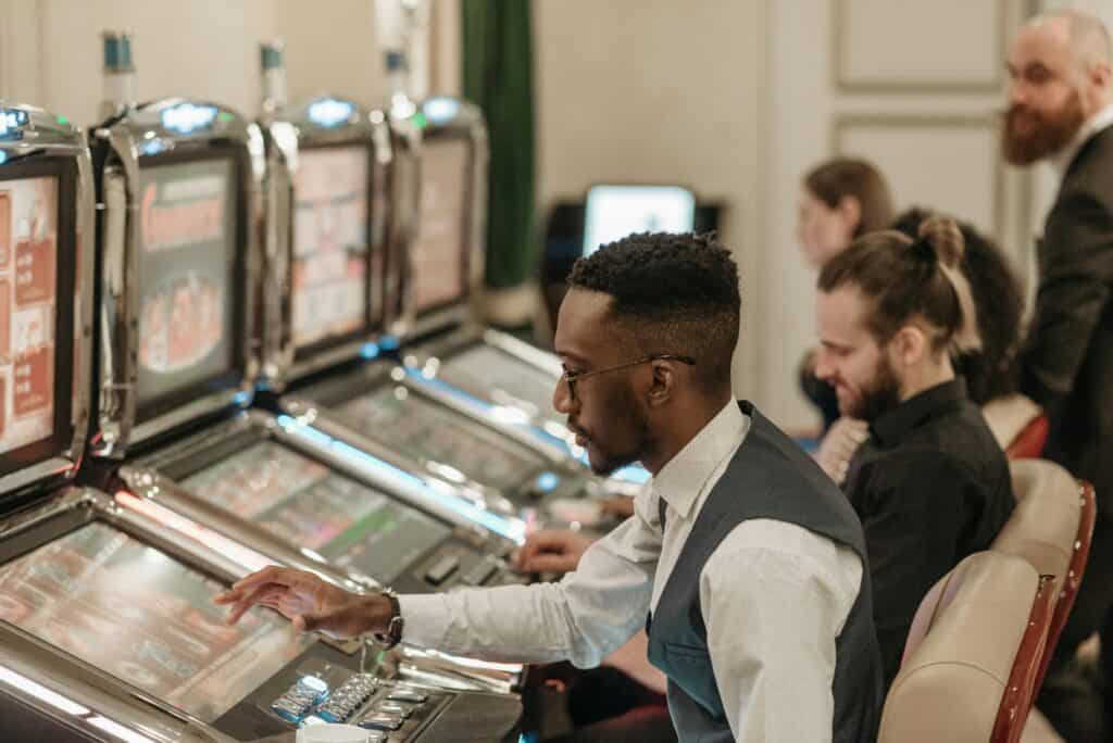 man sitting at machine in casino