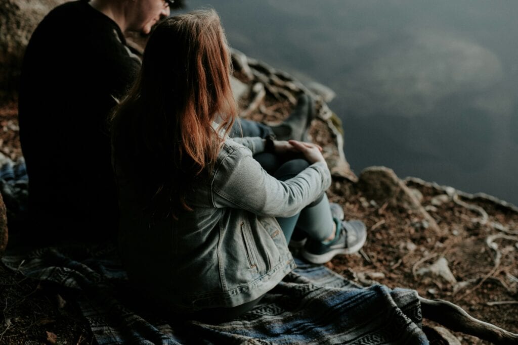 couple sitting on the ground