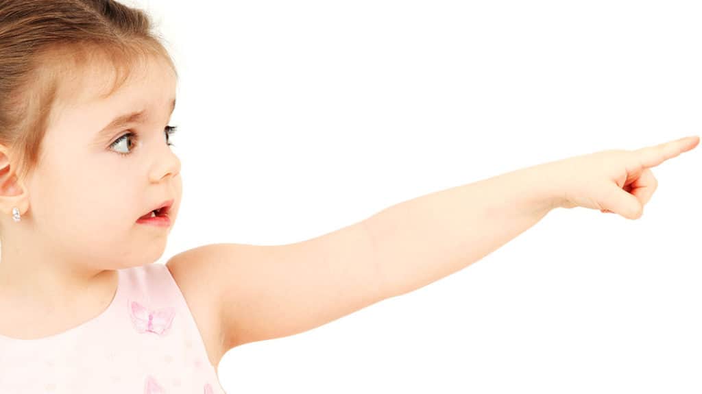 A young child points blame for her behavior