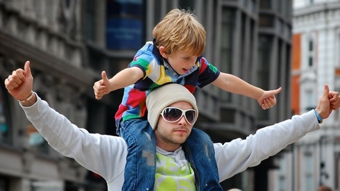 Dad and son giving thumbs ups