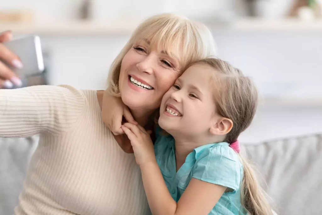 Grandmother taking a photo with her grandchild
